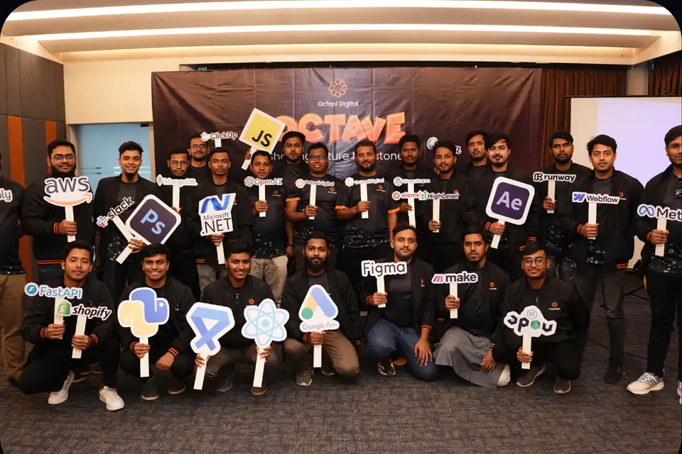 The Octopi creative team with Photoshop and After Effects signs